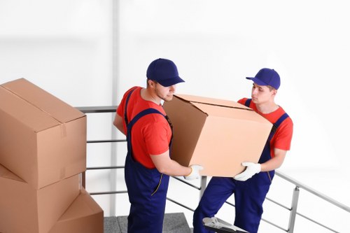 Local removal company staff managing a residential move in Holland Park