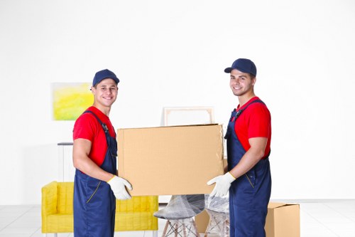 Professional removals team assisting with a home move in Holland Park
