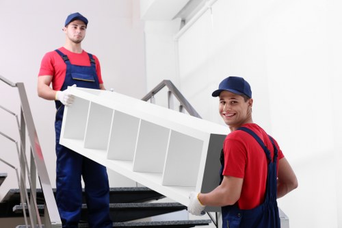 Removal company team loading boxes for a house move