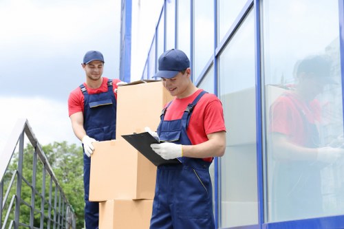 Removal team planning a move in Holland Park residential street