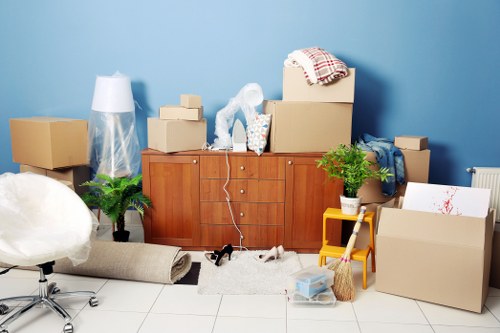 Careful handling of household items during a Holland Park move