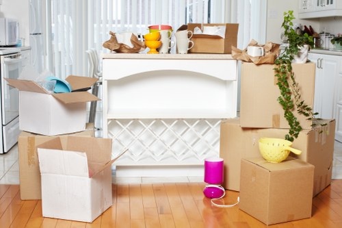 Packing and loading furniture into a moving truck for a Holland Park move