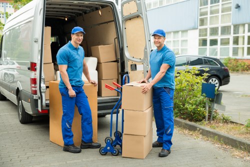 Local removals crew loading items safely into a vehicle