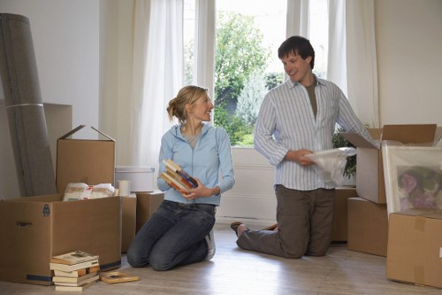 Packed boxes and furniture ready for a local home removal in Holland Park