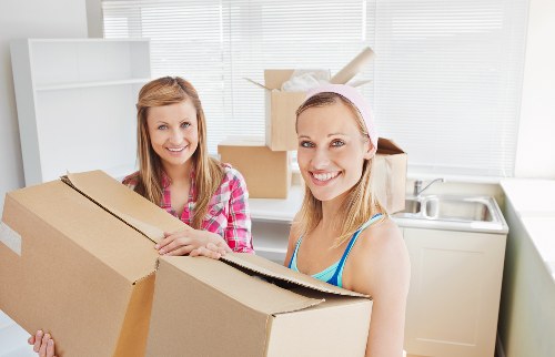 Business relocation team organising equipment for an office move in West London