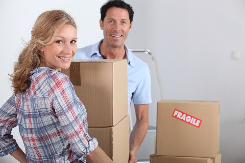 Careful handling of household furniture during a flat move in Holland Park
