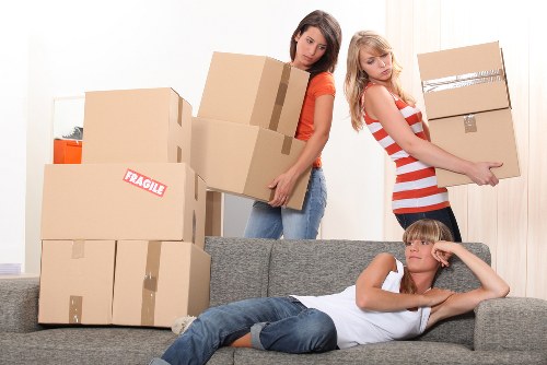 Removal team packing furniture for a local Holland Park home