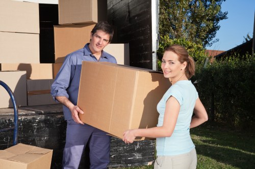 Packing materials and wrapped household items ready for transport