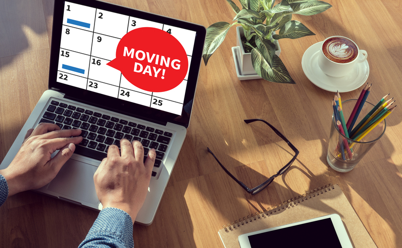 Office removal team moving business equipment in West London